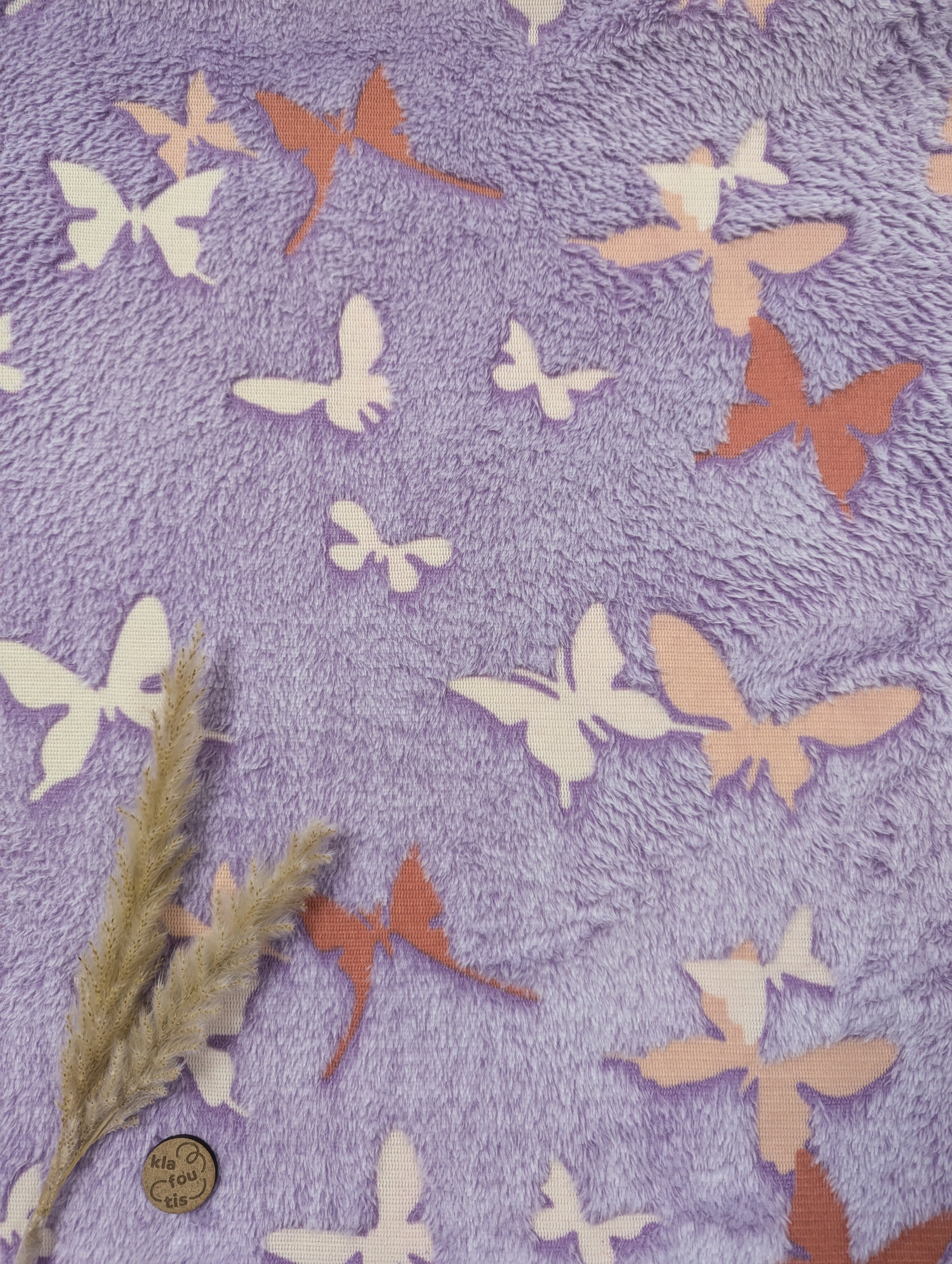 Tissu doudou phosphorescent mauve - papillons