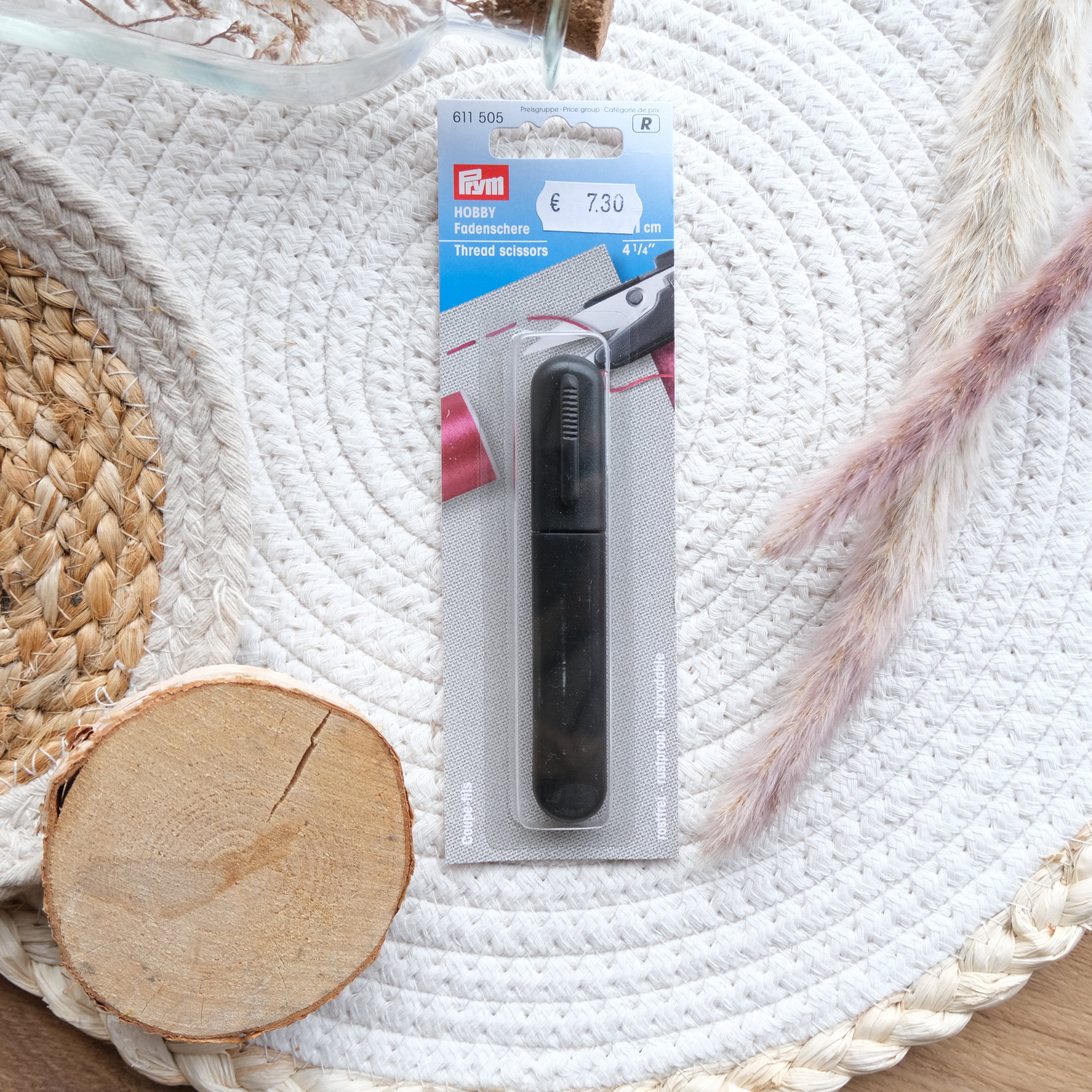 Coupe-fils avec capuchon